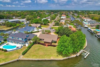 Tucked away in one of Gulf Breeze's most desirable waterfront on Tiger Point Golf and Country Club in Florida - for sale on GolfHomes.com, golf home, golf lot