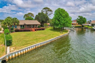 Tucked away in one of Gulf Breeze's most desirable waterfront on Tiger Point Golf and Country Club in Florida - for sale on GolfHomes.com, golf home, golf lot