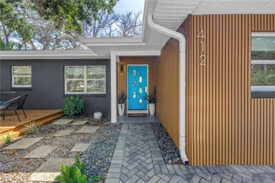 5-bedroom, 3-bathroom Mid-Century home in desirable Dunedin on The Dunedin Country Club in Florida - for sale on GolfHomes.com, golf home, golf lot