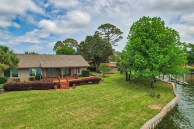 Tucked away in one of Gulf Breeze's most desirable waterfront on Tiger Point Golf and Country Club in Florida - for sale on GolfHomes.com, golf home, golf lot