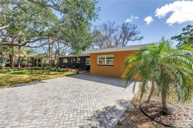 5-bedroom, 3-bathroom Mid-Century home in desirable Dunedin on The Dunedin Country Club in Florida - for sale on GolfHomes.com, golf home, golf lot