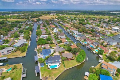 Tucked away in one of Gulf Breeze's most desirable waterfront on Tiger Point Golf and Country Club in Florida - for sale on GolfHomes.com, golf home, golf lot