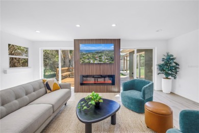 5-bedroom, 3-bathroom Mid-Century home in desirable Dunedin on The Dunedin Country Club in Florida - for sale on GolfHomes.com, golf home, golf lot