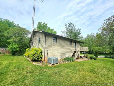 This home features 3 bedroom 2 bathroom, a huge deck that offers on Lake Valley Country Club in Missouri - for sale on GolfHomes.com, golf home, golf lot