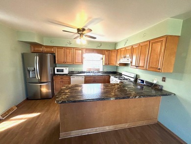 Welcome home to this beautifully maintained 3 Bedroom, 3 on Lakes of the Four Seasons Country Club in Indiana - for sale on GolfHomes.com, golf home, golf lot