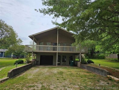 This home features 3 bedroom 2 bathroom, a huge deck that offers on Lake Valley Country Club in Missouri - for sale on GolfHomes.com, golf home, golf lot