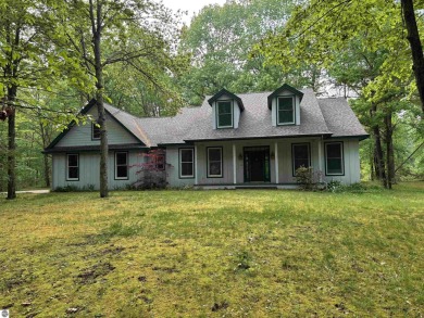 This beautiful custom built home offers 3 bedrooms/3 bathrooms on Singing Bridge Golf Course in Michigan - for sale on GolfHomes.com, golf home, golf lot