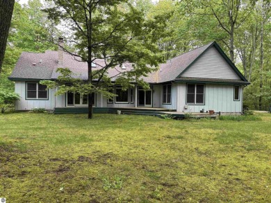 This beautiful custom built home offers 3 bedrooms/3 bathrooms on Singing Bridge Golf Course in Michigan - for sale on GolfHomes.com, golf home, golf lot