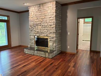 This beautiful custom built home offers 3 bedrooms/3 bathrooms on Singing Bridge Golf Course in Michigan - for sale on GolfHomes.com, golf home, golf lot
