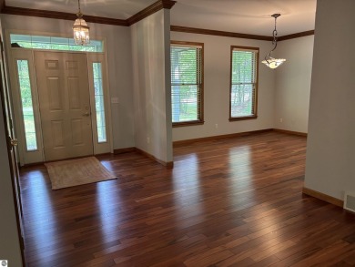 This beautiful custom built home offers 3 bedrooms/3 bathrooms on Singing Bridge Golf Course in Michigan - for sale on GolfHomes.com, golf home, golf lot