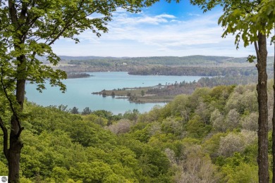 This studio condo offers stunning Lake Bellaire and sunset views on Shanty Creek Golf Course in Michigan - for sale on GolfHomes.com, golf home, golf lot
