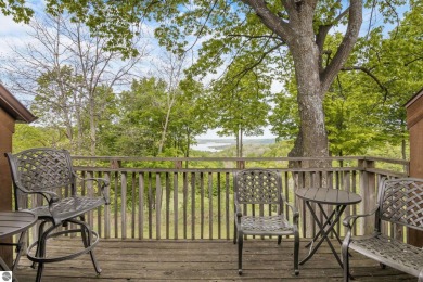 This studio condo offers stunning Lake Bellaire and sunset views on Shanty Creek Golf Course in Michigan - for sale on GolfHomes.com, golf home, golf lot