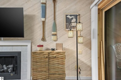 This studio condo offers stunning Lake Bellaire and sunset views on Shanty Creek Golf Course in Michigan - for sale on GolfHomes.com, golf home, golf lot