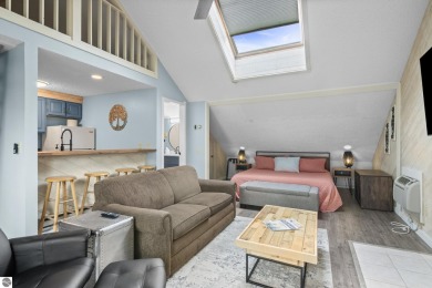 This studio condo offers stunning Lake Bellaire and sunset views on Shanty Creek Golf Course in Michigan - for sale on GolfHomes.com, golf home, golf lot