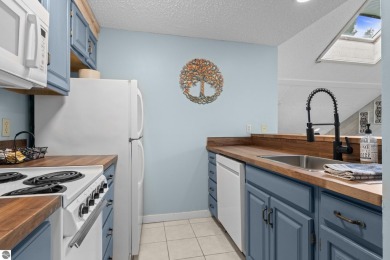 This studio condo offers stunning Lake Bellaire and sunset views on Shanty Creek Golf Course in Michigan - for sale on GolfHomes.com, golf home, golf lot