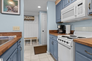 This studio condo offers stunning Lake Bellaire and sunset views on Shanty Creek Golf Course in Michigan - for sale on GolfHomes.com, golf home, golf lot