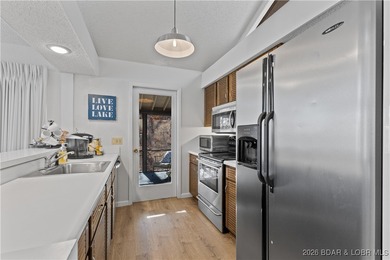 Located in the iconic Tan Tar A Estates, adjacent to on The Oaks Golf Course in Missouri - for sale on GolfHomes.com, golf home, golf lot