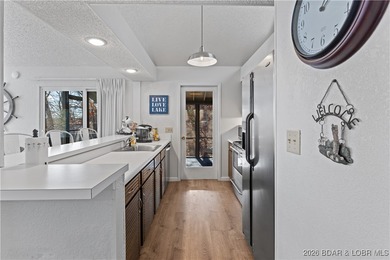 Located in the iconic Tan Tar A Estates, adjacent to on The Oaks Golf Course in Missouri - for sale on GolfHomes.com, golf home, golf lot