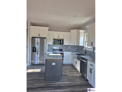 Must see to believe!  Contemporary home with an open floor plan on Lincoln Trail Country Club in Kentucky - for sale on GolfHomes.com, golf home, golf lot