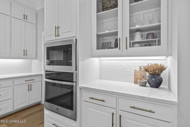 Welcome to this meticulously maintained 3-bedroom, 2-bath home on Lake Caroline Golf Club in Mississippi - for sale on GolfHomes.com, golf home, golf lot