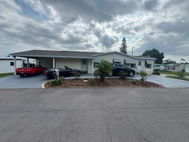 This one grabs your attention immediately as you approach the on Golden Lakes Golf Course in Florida - for sale on GolfHomes.com, golf home, golf lot