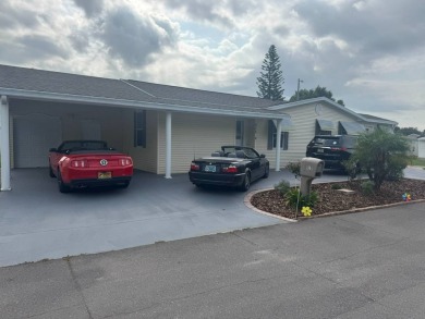 This one grabs your attention immediately as you approach the on Golden Lakes Golf Course in Florida - for sale on GolfHomes.com, golf home, golf lot