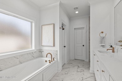 Welcome to this meticulously maintained 3-bedroom, 2-bath home on Lake Caroline Golf Club in Mississippi - for sale on GolfHomes.com, golf home, golf lot