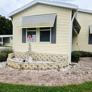This one grabs your attention immediately as you approach the on Golden Lakes Golf Course in Florida - for sale on GolfHomes.com, golf home, golf lot