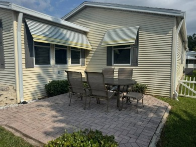 This one grabs your attention immediately as you approach the on Golden Lakes Golf Course in Florida - for sale on GolfHomes.com, golf home, golf lot