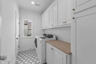 Welcome to this meticulously maintained 3-bedroom, 2-bath home on Lake Caroline Golf Club in Mississippi - for sale on GolfHomes.com, golf home, golf lot