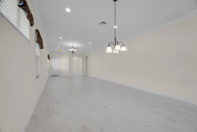 This beautifully maintained home offers the perfect blend of on PGA Golf Club in PGA Village in Florida - for sale on GolfHomes.com, golf home, golf lot