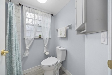 Discover the charm of this beautifully updated 2-bedroom on Country Club At Silver Springs Shores in Florida - for sale on GolfHomes.com, golf home, golf lot