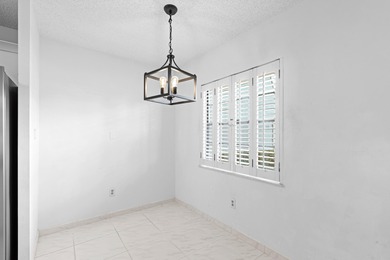 GORGEOUS FULLY 1ST FLOOR CONDO | PRESTIGIOUS 55+ COMMUNITY OF on Boca Dunes Golf and Country Club in Florida - for sale on GolfHomes.com, golf home, golf lot