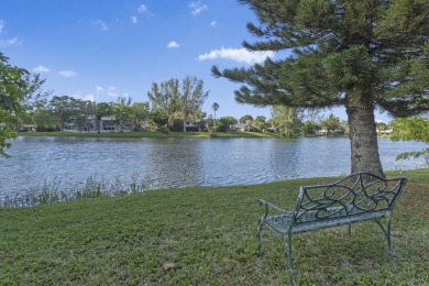 Step inside this cozy condo on the water in the quite community on Inverrary Country Club in Florida - for sale on GolfHomes.com, golf home, golf lot