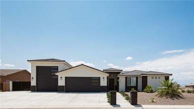 Presenting 6393 S Via De Oro, Fort Mohave, Arizona, a custom on Los Lagos Golf Club in Arizona - for sale on GolfHomes.com, golf home, golf lot