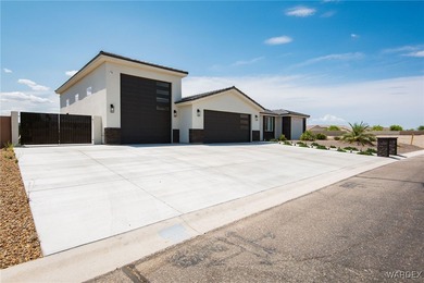 Presenting 6393 S Via De Oro, Fort Mohave, Arizona, a custom on Los Lagos Golf Club in Arizona - for sale on GolfHomes.com, golf home, golf lot