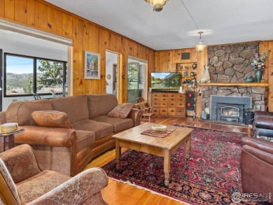 Step inside this charming rustic cabin that offers a peaceful on Estes Park Golf Course in Colorado - for sale on GolfHomes.com, golf home, golf lot
