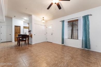 The perfect set up! Beautiful condo with an oversized, 2 car on London Bridge Golf Course in Arizona - for sale on GolfHomes.com, golf home, golf lot