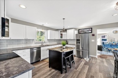 Beautiful 1.5-story waterfront home in the gated lake & golf on Raintree Country Club in Missouri - for sale on GolfHomes.com, golf home, golf lot