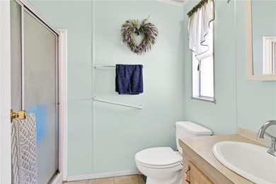 Nice 1993 home for the price in this 55 plus community of Snug on Barefoot Bay Golf Course in Florida - for sale on GolfHomes.com, golf home, golf lot