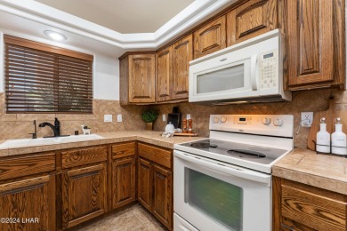 The perfect set up! Beautiful condo with an oversized, 2 car on London Bridge Golf Course in Arizona - for sale on GolfHomes.com, golf home, golf lot