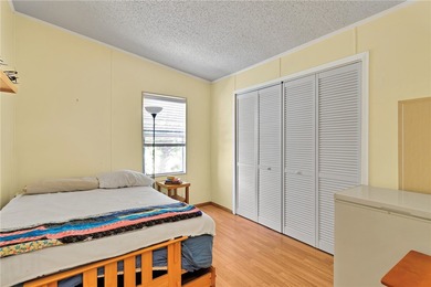 Nice 1993 home for the price in this 55 plus community of Snug on Barefoot Bay Golf Course in Florida - for sale on GolfHomes.com, golf home, golf lot