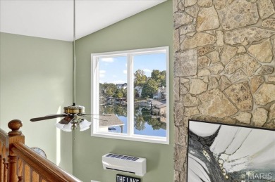 Beautiful 1.5-story waterfront home in the gated lake & golf on Raintree Country Club in Missouri - for sale on GolfHomes.com, golf home, golf lot