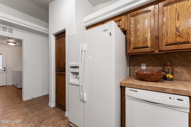 The perfect set up! Beautiful condo with an oversized, 2 car on London Bridge Golf Course in Arizona - for sale on GolfHomes.com, golf home, golf lot