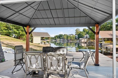 Beautiful 1.5-story waterfront home in the gated lake & golf on Raintree Country Club in Missouri - for sale on GolfHomes.com, golf home, golf lot
