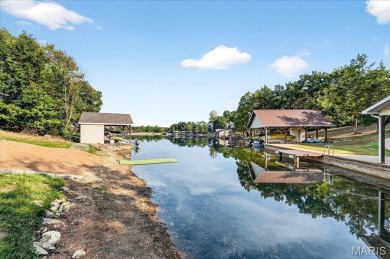 Beautiful 1.5-story waterfront home in the gated lake & golf on Raintree Country Club in Missouri - for sale on GolfHomes.com, golf home, golf lot