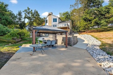 Beautiful 1.5-story waterfront home in the gated lake & golf on Raintree Country Club in Missouri - for sale on GolfHomes.com, golf home, golf lot