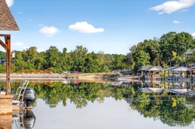 Beautiful 1.5-story waterfront home in the gated lake & golf on Raintree Country Club in Missouri - for sale on GolfHomes.com, golf home, golf lot