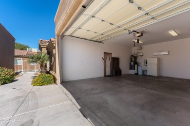 The perfect set up! Beautiful condo with an oversized, 2 car on London Bridge Golf Course in Arizona - for sale on GolfHomes.com, golf home, golf lot
