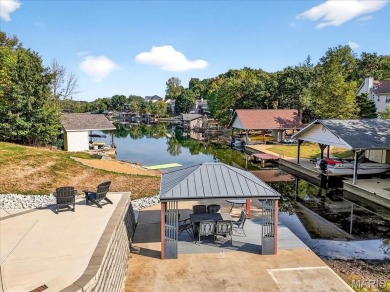 Beautiful 1.5-story waterfront home in the gated lake & golf on Raintree Country Club in Missouri - for sale on GolfHomes.com, golf home, golf lot